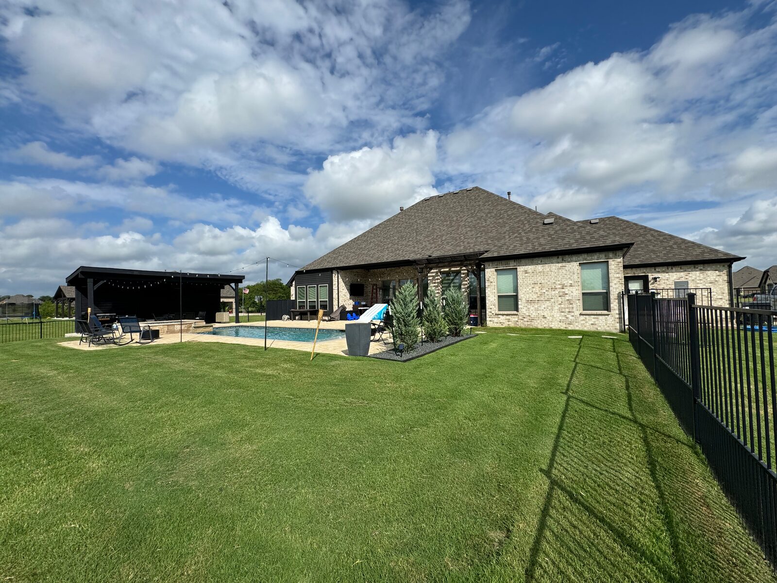 Poolside backyard lawn with dense, even coverage