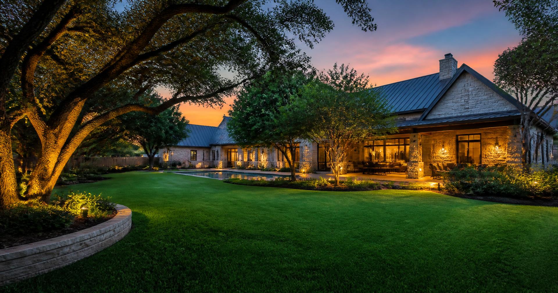 Lush green Texas backyard lawn at dusk